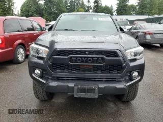 2020 Toyota Tacoma SR5 with VIN 3TMDZ5BN2LM097782, listed as a Copart auction lot 61573465 with 57,321 mi miles and Salvage title. Bid and sale history available at DreamBid. Image 5.