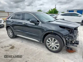 2020 Cadillac XT4 FWD Premium Luxury with VIN 1GYFZCR40LF073517, listed as a Copart auction lot 60121635 with 79,450 mi miles and Salvage title. Bid and sale history available at DreamBid. Image 4.