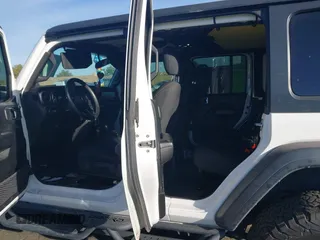 2020 Jeep Wrangler Unlimited Sport S z VIN 1C4HJXDG7LW201699, wystawiony jako IAAI lot #41651137 z przebiegiem 66 777 mil mil oraz . Historia ofert i sprzedaży dostępna na DreamBid. Obrazek 8.