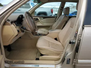 2000 Mercedes-Benz E-Class with VIN WDBJF82J0YX040071, listed as a Copart auction lot 50001165 with 145,638 mi miles and Salvage Title. Bid and sale history available at carsss.com. Image 7.