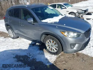 2013 Mazda CX-5 Touring with VIN JM3KE2CE7D0129623, listed as a IAAI auction lot 41344623 with 147,025 mi miles. Bid and sale history available at carsss.com. Image 1.