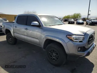 2018 Toyota Tacoma SR5 z VIN 3TMAZ5CN8JM077857, wystawiony jako Copart lot #52570945 z przebiegiem 50 182 mil mil oraz Szkoda całkowita • Salvage title. Historia ofert i sprzedaży dostępna na DreamBid. Obrazek 4.