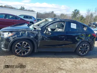 2016 Mazda CX-5 Grand Touring with VIN JM3KE4DY4G0909782, listed as a IAAI auction lot 41006111 with 30,135 mi miles. Bid and sale history available at carsss.com. Image 13.