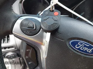 2012 Ford Focus SE with VIN 1FAHP3F2XCL122141, listed as a IAAI auction lot 42008877 with 122,743 mi miles. Bid and sale history available at carsss.com. Image 11.