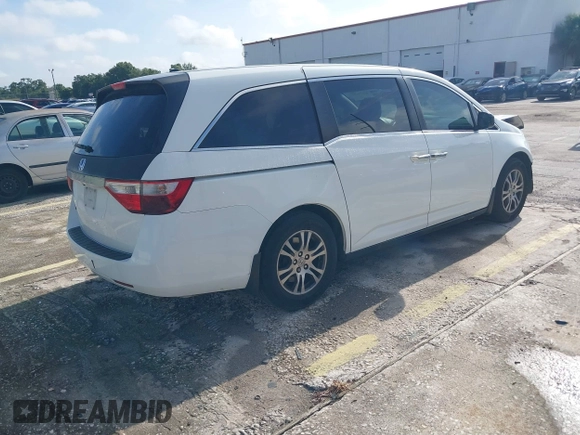 2012 Honda Odyssey EX-L z VIN 5FNRL5H61CB032353, wystawiony jako IAAI lot #42471691 z przebiegiem 186 257 mil mil oraz . Historia ofert i sprzedaży dostępna na DreamBid. Obrazek 4.
