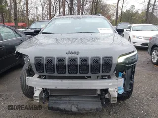 2023 Jeep Cherokee Altitude Lux with VIN 1C4PJMMB8PD114958, listed as a IAAI auction lot 41862302 with 64,341 mi miles. Bid and sale history available at carsss.com. Image 12.