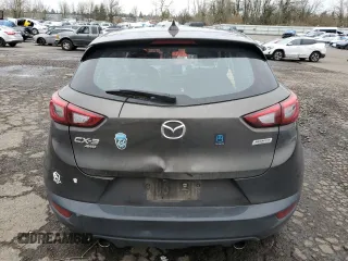 2018 Mazda CX-3 Sport z VIN JM1DKFB77J0312732, wystawiony jako Copart lot #45720065 z przebiegiem 99 866 mil mil oraz Szkoda całkowita • Salvage title. Historia ofert i sprzedaży dostępna na DreamBid. Obrazek 6.