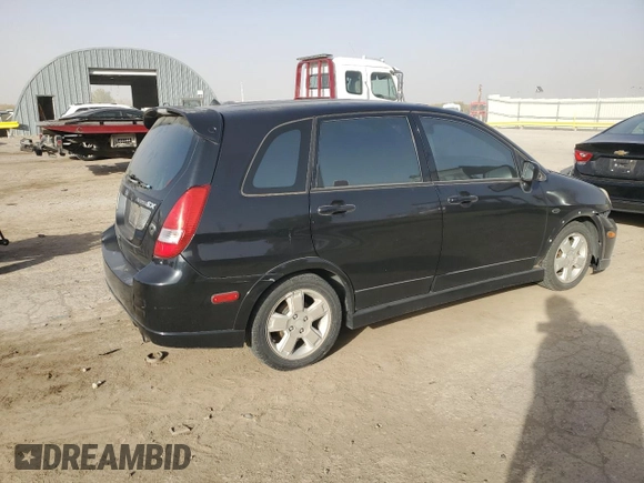 2003 Suzuki Aerio SX z VIN JS2RC41H135205642, wystawiony jako Copart lot #77690224 z przebiegiem 161 414 mil mil oraz Szkoda całkowita • Salvage title. Historia ofert i sprzedaży dostępna na DreamBid. Obrazek 3.
