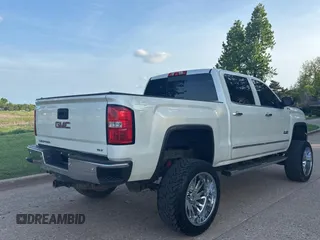 2015 GMC Sierra 1500 SLT with VIN 3GTU2VEC0FG239547, listed as a Copart auction lot 54957305 with 135,497 mi miles and Clean Title. Bid and sale history available at DreamBid. Image 4.