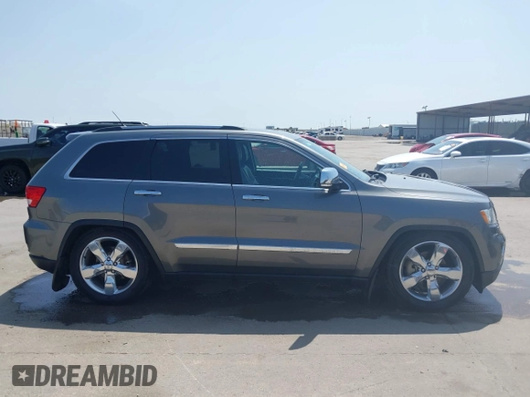 2013 Jeep Grand Cherokee Overland with VIN 1C4RJFCG2DC611877, listed as a IAAI auction lot 41910800 with 151,457 mi miles. Bid and sale history available at carsss.com. Image 13.