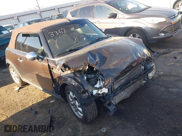 2011 MINI Convertible with VIN WMWZN3C55BT133367, listed as a IAAI auction lot 41781374 with 124,036 mi miles and . Bid and sale history available at DreamBid. Image 1.