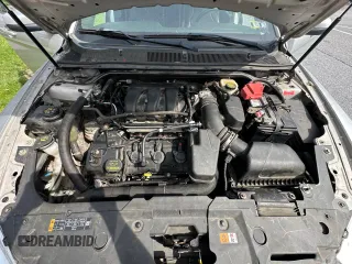 2013 Ford Taurus SEL with VIN 1FAHP2E85DG199414, listed as a Copart auction lot 54572685 with 122,416 mi miles and Clean Title. Bid and sale history available at carsss.com. Image 7.