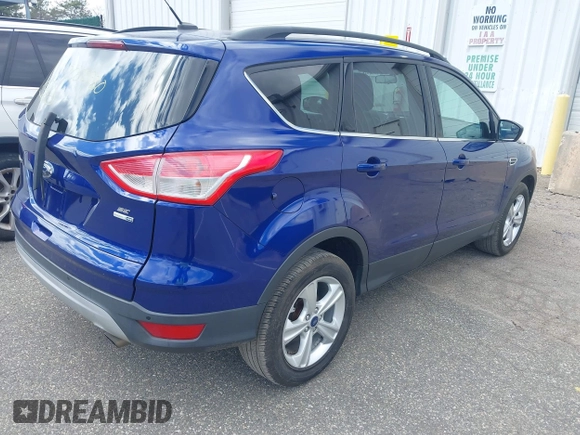 2014 Ford Escape SE with VIN 1FMCU9G93EUC54050, listed as a IAAI auction lot 42062980 with 129,015 mi miles. Bid and sale history available at carsss.com. Image 4.