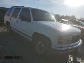 1999 GMC Yukon with VIN 1GKEC13R6XJ808715, listed as a Copart auction lot 83407094 with 340,933 mi miles and Salvage Title. Bid and sale history available at carsss.com. Image 4.