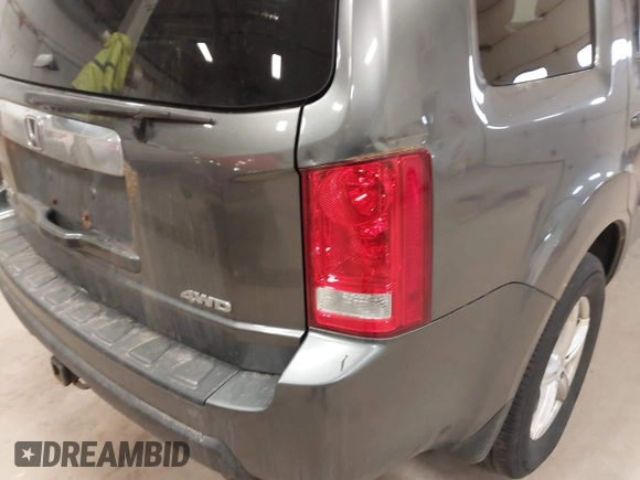 2011 Honda Pilot EX-L with VIN 5FNYF4H55BB039079, listed as a IAAI auction lot 42029278 with 173,216 mi miles. Bid and sale history available at carsss.com. Image 6.