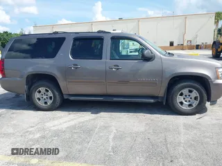 2012 Chevrolet Suburban LT with VIN 1GNSKJE72CR130111, listed as a IAAI auction lot 42699365 with 216,827 mi miles and . Bid and sale history available at DreamBid. Image 13.