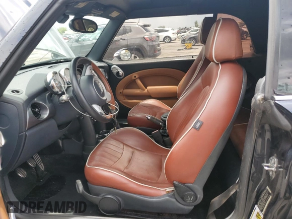 2007 MINI Convertible S with VIN WMWRH33597TJ43818, listed as a Copart auction lot 64623075 with 104,889 mi miles and Clean title. Bid and sale history available at DreamBid. Image 7.