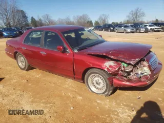 1998 Ford Crown Victoria LX с VIN 2FAFP74W3WX138757, выставлен на аукционе Copart как лот 87867945 с пробегом 148 827 миль миль и Списание • Salvage title. История ставок и продаж доступна на DreamBid. Изображение 4.