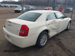 2009 Chrysler 300 LX with VIN 2C3KA43D09H508381, listed as a IAAI auction lot 41834673 with 112,152 mi miles. Bid and sale history available at carsss.com. Image 4.