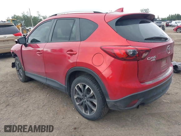 2016 Mazda CX-5 Grand Touring z VIN JM3KE4DY7G0687318, wystawiony jako IAAI lot #42228585 z przebiegiem 188 793 mil mil oraz . Historia ofert i sprzedaży dostępna na DreamBid. Obrazek 3.