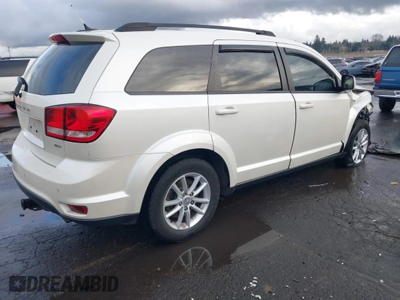 2014 Dodge Journey SXT with VIN 3C4PDCBGXET182430, listed as a IAAI auction lot 41599489 with 143,889 mi miles. Bid and sale history available at carsss.com. Image 4.