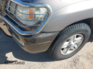 2000 Lexus LX 470 with VIN JT6HT00WXY0079873, listed as a IAAI auction lot 41605770 with 302,758 mi miles and . Bid and sale history available at DreamBid. Image 6.
