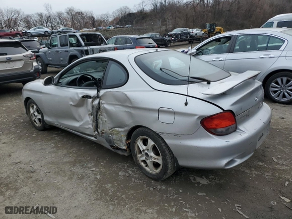2001 Hyundai Tiburon with VIN KMHJG35F31U224416, listed as a Copart auction lot 83243684 with 59,473 mi miles and Salvage Title. Bid and sale history available at carsss.com. Image 2.