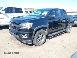 2018 Chevrolet Colorado 4WD Z71 z VIN 1GCGTDEN0J1173420, wystawiony jako IAAI lot #41971813 z przebiegiem 98 499 mil mil oraz . Historia ofert i sprzedaży dostępna na DreamBid. Obrazek 2.