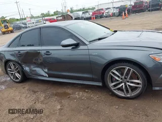 2016 Audi S6 Prestige z VIN WAUH2AFC1GN016187, wystawiony jako IAAI lot #42274744 z przebiegiem 169 821 mil mil oraz . Historia ofert i sprzedaży dostępna na DreamBid. Obrazek 13.