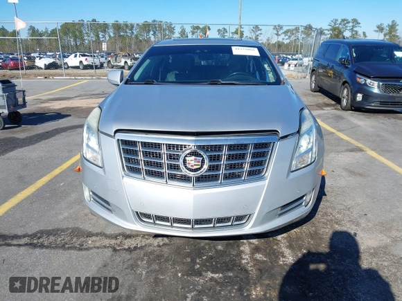 2013 Cadillac XTS Premium z VIN 2G61S5S35D9209252, wystawiony jako IAAI lot #41275066 z przebiegiem 132 311 mil mil oraz . Historia ofert i sprzedaży dostępna na DreamBid. Obrazek 13.