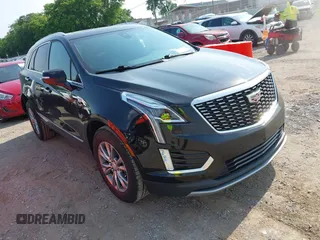 2023 Cadillac XT5 AWD Premium Luxury with VIN 1GYKNDRS0PZ134495, listed as a IAAI auction lot 42402237 with 50,444 mi miles and . Bid and sale history available at DreamBid. Image 1.