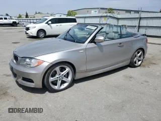 2010 BMW 1 Series 135i with VIN WBAUN9C55AVK41973, listed as a Copart auction lot 54609015 with 144,685 mi miles and Salvage Title. Bid and sale history available at carsss.com. Image 1.