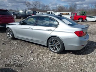 2015 BMW 3 Series 328i with VIN WBA3A5C55FF609490, listed as a IAAI auction lot 42006008 with 110,239 mi miles. Bid and sale history available at carsss.com. Image 3.