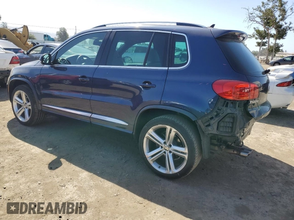 2015 Volkswagen Tiguan SE with VIN WVGAV7AX2FW094359, listed as a Copart auction lot 60101885 with 106,305 mi miles and Salvage title. Bid and sale history available at DreamBid. Image 2.
