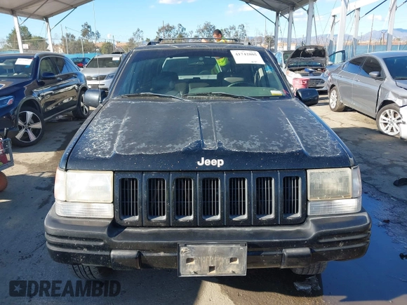1998 Jeep Grand Cherokee Limited z VIN 1J4GZ78Y3WC105625, wystawiony jako IAAI lot #41742805 z przebiegiem 222 045 mil mil oraz . Historia ofert i sprzedaży dostępna na DreamBid. Obrazek 12.