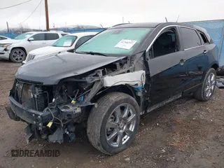 2012 Cadillac SRX Premium Collection with VIN 3GYFNFE35CS599969, listed as a IAAI auction lot 41764337 with 154,864 mi miles and . Bid and sale history available at DreamBid. Image 2.