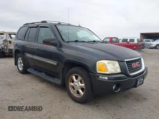 2004 GMC Envoy SLE with VIN 1GKDT13S642431159, listed as a IAAI auction lot 41511508 with 132,653 mi miles. Bid and sale history available at carsss.com. Image 1.