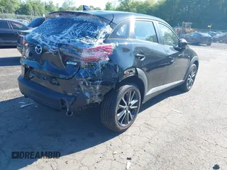 2018 Mazda CX-3 Touring z VIN JM1DKFC73J0321605, wystawiony jako IAAI lot #42355269 z przebiegiem 40 053 mil mil oraz . Historia ofert i sprzedaży dostępna na DreamBid. Obrazek 4.