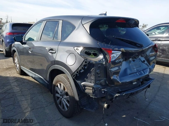 2016 Mazda CX-5 Touring with VIN JM3KE2CY8G0874248, listed as a IAAI auction lot 41679166 with NaN miles. Bid and sale history available at carsss.com. Image 3.