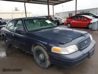 2001 Ford Crown Victoria Police Pkg Police Interceptor with VIN 2FAFP71WX1X127347, listed as a IAAI auction lot 41134745 with 161,180 mi miles. Bid and sale history available at carsss.com. Image 13.