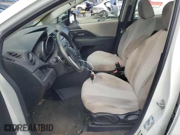 2014 Mazda 5 Touring with VIN JM1CW2CL5E0165062, listed as a Copart auction lot 72452994 with 177,939 mi miles and Salvage Title. Bid and sale history available at DreamBid. Image 7.
