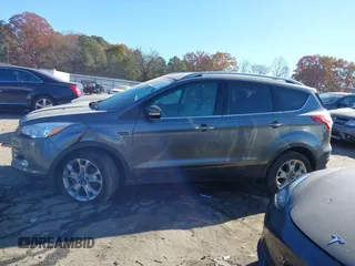 2014 Ford Escape Titanium with VIN 1FMCU9J94EUC50534, listed as a IAAI auction lot 41040341 with 115,502 mi miles. Bid and sale history available at carsss.com. Image 13.