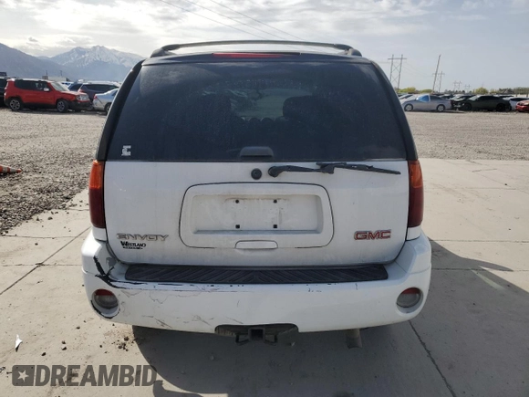 2006 GMC Envoy SLE z VIN 1GKDT13S462156541, wystawiony jako Copart lot #52500615 z przebiegiem 140 558 mil mil oraz Szkody całkowita. Historia ofert i sprzedaży dostępna na DreamBid. Obrazek 6.