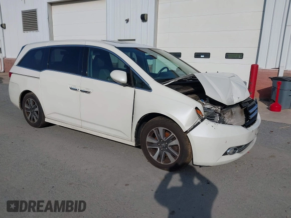 2014 Honda Odyssey Touring with VIN 5FNRL5H94EB001479, listed as a IAAI auction lot 41123678 with 147,269 mi miles and . Bid and sale history available at carsss.com. Image 1.