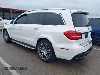 2018 Mercedes-Benz GLS 63 AMG with VIN 4JGDF7FE1JB099084, listed as a IAAI auction lot 42220385 with 97,904 mi miles and . Bid and sale history available at DreamBid. Image 3.