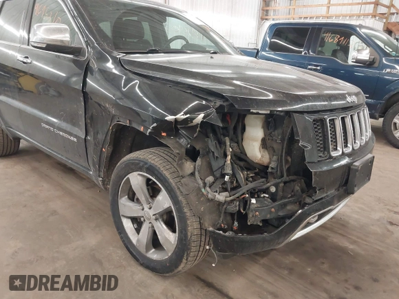 2014 Jeep Grand Cherokee Overland with VIN 1C4RJFCG8EC177899, listed as a IAAI auction lot 41695290 with 200,867 mi miles and . Bid and sale history available at DreamBid. Image 6.