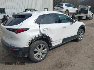 2021 Mazda CX-30 Premium with VIN 3MVDMBDM8MM216520, listed as a IAAI auction lot 41848596 with 60,353 mi miles and . Bid and sale history available at DreamBid. Image 4.