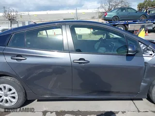 2022 Toyota Prius L Eco with VIN JTDKAMFU4N3177258, listed as a IAAI auction lot 39148811 with 50,902 mi miles. Bid and sale history available at carsss.com. Image 13.