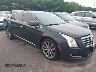 2014 Cadillac XTS z VIN 2G61L5S32E9326141, wystawiony jako IAAI lot #42300854 z przebiegiem 200 284 mil mil oraz . Historia ofert i sprzedaży dostępna na DreamBid. Obrazek 1.