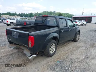 2015 Nissan Frontier S with VIN 1N6AD0EV2FN735908, listed as a IAAI auction lot 42388456 with 164,889 mi miles and . Bid and sale history available at DreamBid. Image 4.